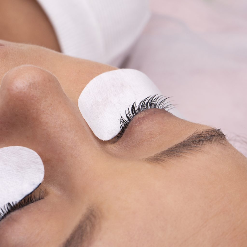 high-angle-woman-wearing-eye-patches
