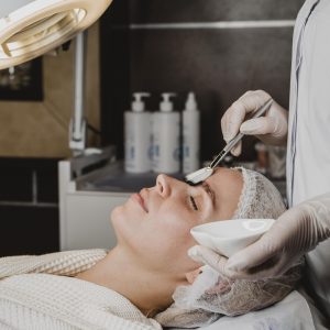 side-view-young-woman-getting-face-skin-treatment-spa